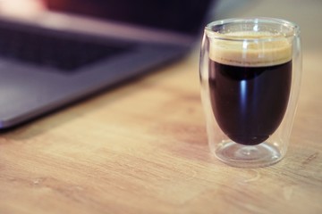 Coffee time in office. Capsule espresso in double glass cup - 100% arabica