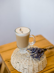 cappuccino with lavender on a wooden table
