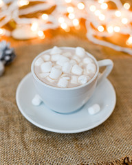 Obraz na płótnie Canvas cocoa with marshmallows in a white cup