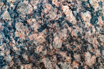 Natural stone granite background or stone texture for design. View from above