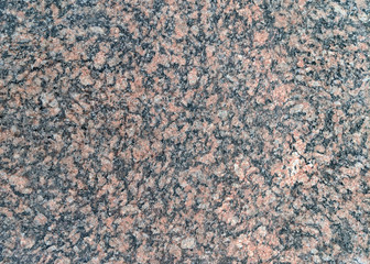 Natural stone granite background or stone texture for design. View from above