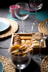 Different bread toast slices on a wooden box on a prepared and served food table on a restaurant