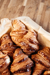 Croissant in basket, baking for cafe, menu, recipe.
