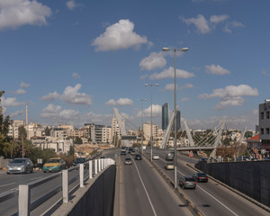 Fototapeta na wymiar Abdoun Bridge at blue aky & white clouds