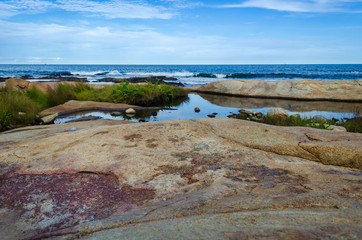 Quiet location in the shoreline rocks at Black Point in Rhode Island	