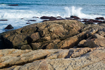 Rocks and surf at the stark shoreline of Black Point Rhode Island