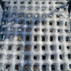 Chair grid covered with ice 