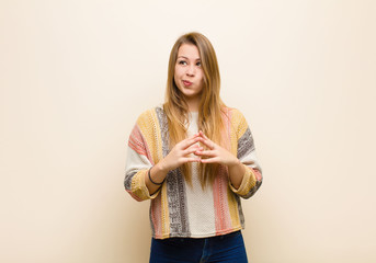 young blonde woman scheming and conspiring, thinking devious tricks and cheats, cunning and...