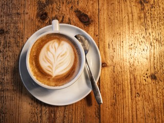 Cappuccino on wooden table
