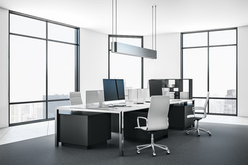 Empty computer in contemporary office interior