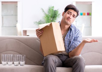 Man receiving wrong parcel with glasses