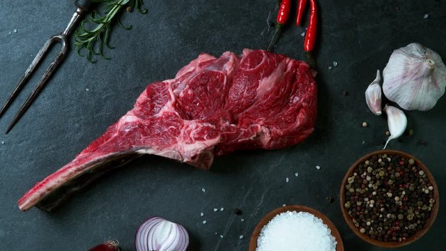 Flying piece of raw beef tomahawk steak. Filmed on high speed cinema camera, 1000 fps.