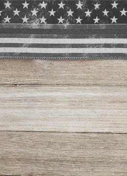 American thin gray line flag over weathered wood background