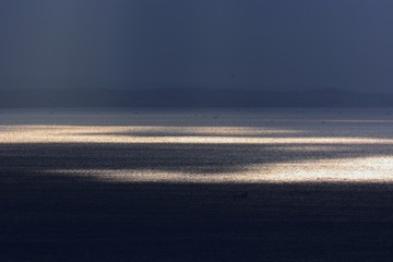 Background material of natural scene / Sunrise shine reflected on the sea surface.