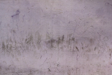 dirty and messy wall with irregular black dirt and footprints on a flat surface rough background