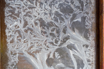 Beautiful frosty patterns on the window glass.