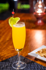 Delicious food and drink on wooden table with candle in restaurant