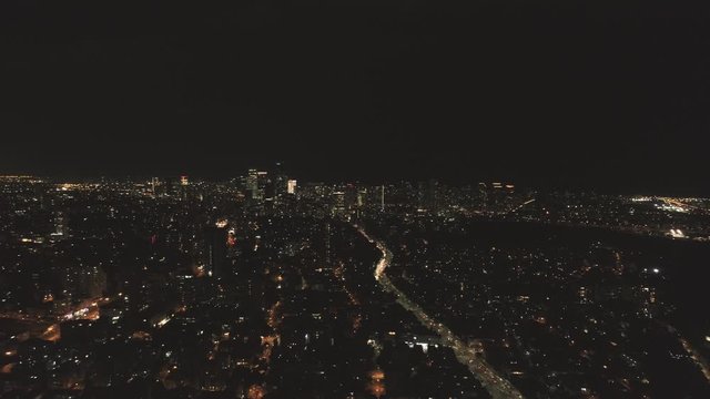 City Night light scene from a drone, Aerial above modern Tel Aviv city at nighttime with illuminated skyline. Skyscraper urban view
