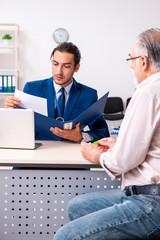Financial advisor giving retirement advice to old man
