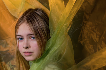 Portrait of a girl in a Golden background