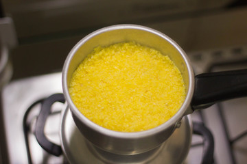 Cuscuz being prepared in the pan - Traditional dish from northeastern Brazil. Couscous can be made from flour, corn, rice or cassava. (Pan called cuscuizeira in Brazil)