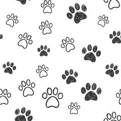 Fototapeta premium Dog paw doodles seamless pattern. Doggie love background. Puppy cute footprints.