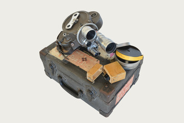 old movie camera on case isolated on white background