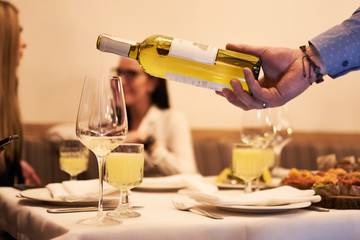 bartender pouring beer in glass