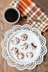 Chocolate Almond Crinkle Cookies on a White Plate