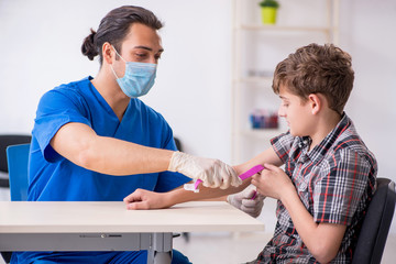 Young boy visiting doctor in hospital