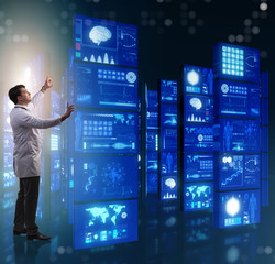 Doctor in telemedicine concept pressing buttons