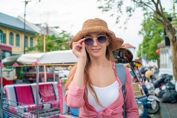 Happy tourist women wear sun glasses travel in buddhism temple of Bangkok city