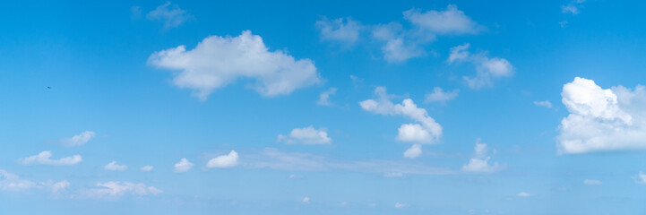 Naklejka na ściany i meble Panorama shot, Beautiful white clouds on blue sky. View from high mountain