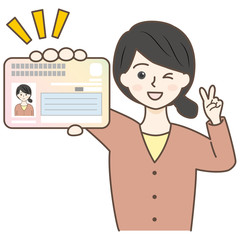 マイナンバーカードを持ってピースしてる女性・主婦