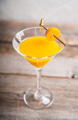 Sweet cocktail with kumquats on rustic background. Selective focus. Shallow depth of field.