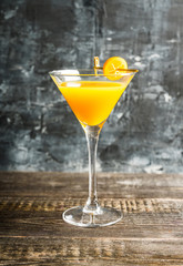 Sweet cocktail with kumquats on rustic background. Selective focus. Shallow depth of field.