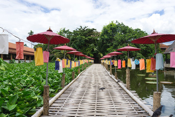 Fototapeta na wymiar Bamboo bridge with colorful paper lantern