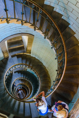 Fototapeta premium Beautiful spiral staircase to the top of Eckmuhl lighthouse, on the Penmarsh Peninsula. Brittany. France