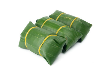 Banana leaf wrapped Thai dessert or food for steamed isolated on white background.