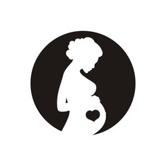 Silhouette of a pregnant young girl