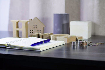 Saving concept by making ledger to save coin to collect in the bottle and use thai currency, Save up money for home concept