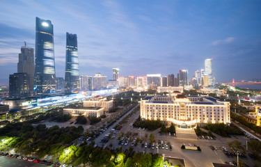 Bird view at Nanchang China. Skyscraper under construction in foreground. Fog, overcast sky and pollution. Bund (Nanchang) area