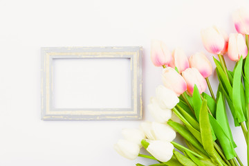 Obraz na płótnie Canvas Happy Women's Day, Mother's Day and Valentine's Day concept. top view flat lay Tulip flower and photo frame