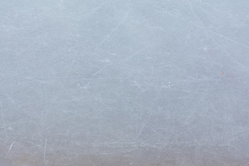Ice hockey rink scratches surface abstract background.