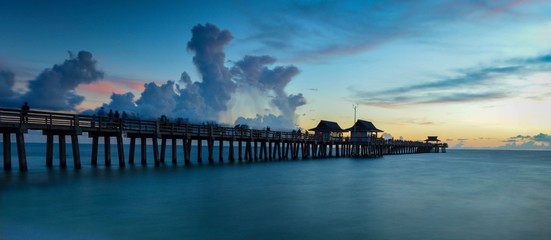 Fototapeta premium Old Pier Seashore Under Stormy Dusk Sky