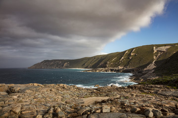 Dramatic early morning light and crashing waves in Torndirrup National Park, Albany, Western Australia