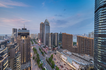 Obraz premium Bird view at Nanchang China. Skyscraper under construction in foreground. Fog, overcast sky and pollution. Bund (Nanchang) area