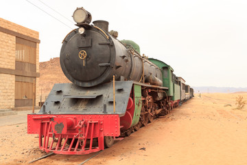 Fototapeta na wymiar Steam locomotive and train wagons at Hejaz railway station near Wadi Rum, Jordan