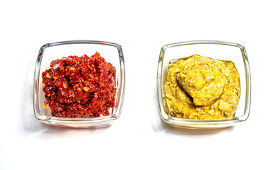 dried tomatoes sauce in a bowl isolated on white