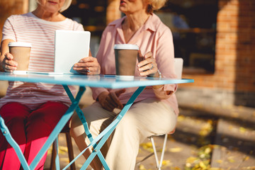 Old friends drinking their morning coffee and talking
